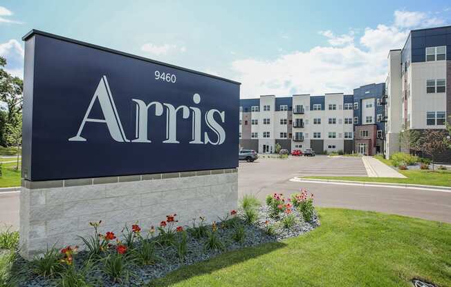 a sign in front of an apartment complex