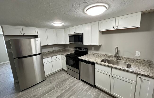 Renovated 3/1 w/carport and detached garage