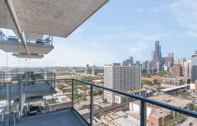 a balcony with a view of a city and a skyscraper at One 333, Illinois, 60605