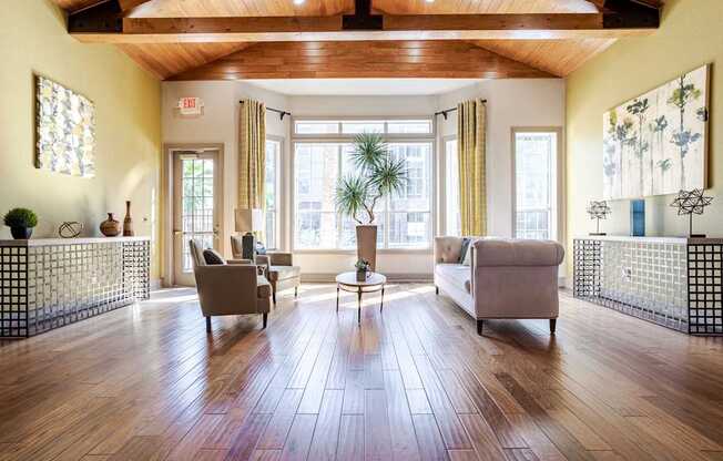 Affordable Houston Apartments – Gramercy Park – inside our clubhouse with seating area in front of massive windows