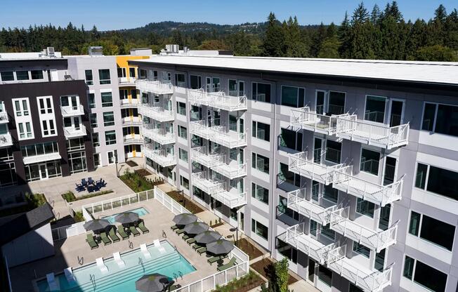 Enjoy a resort-style pool, lush landscaped courtyard, and inviting grilling stations perfect for outdoor living.