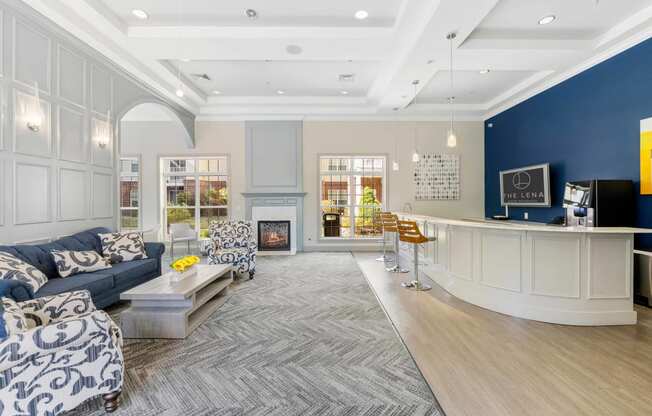 a living room with couches and a coffee table in front of a fireplace  at The Lena, Raritan