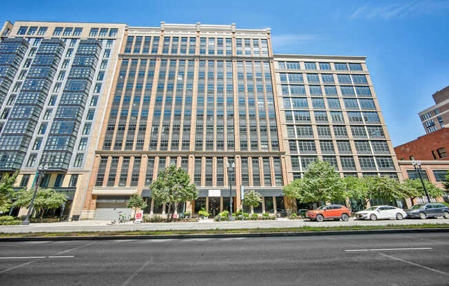 A large building with a parking lot in front of it.