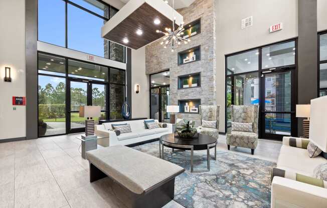 a living room with couches and chairs and a fireplace