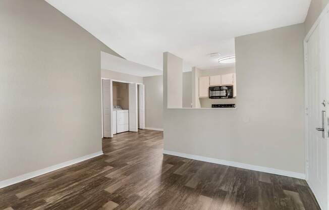 Model living room with hard wood vinyl flooring at Mirage on Kernan in Jacksonville, Florida.