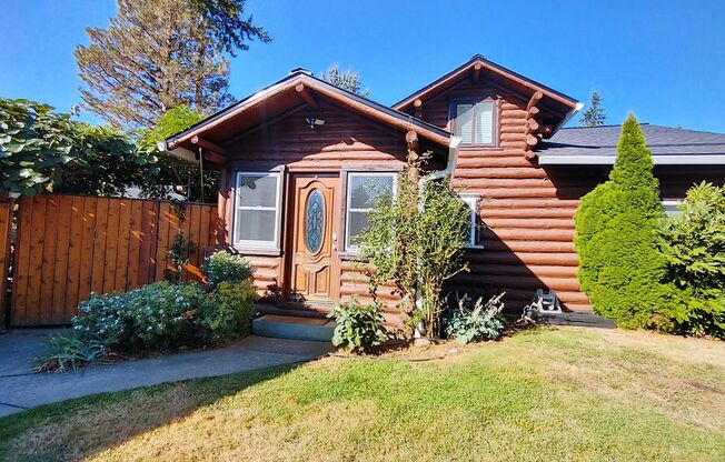 Amazing Log Cabin on a Large Corner Lot with Oversized 2 Car Garage!