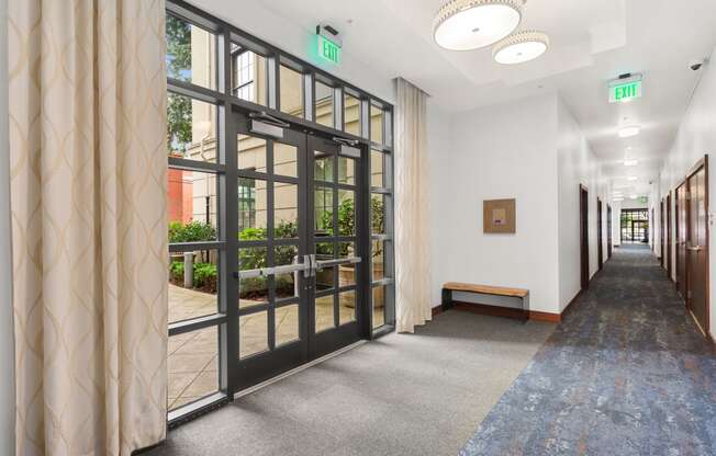 a hallway with doors and windows in a building