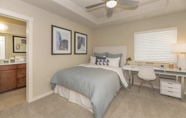 bedroom with ceiling fan and window