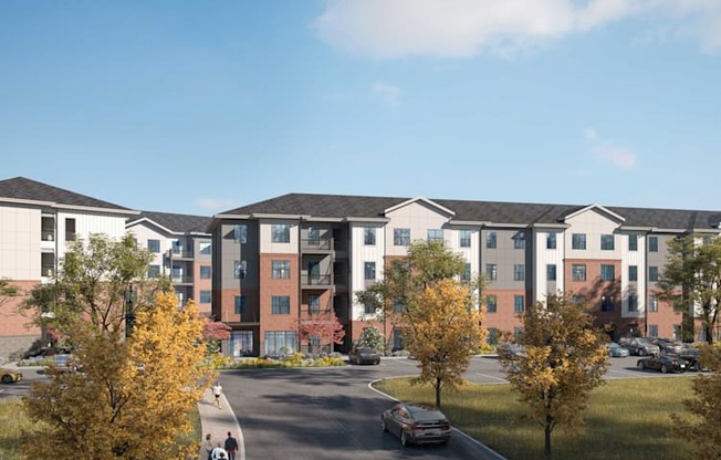 A large apartment complex with a parking lot in front.