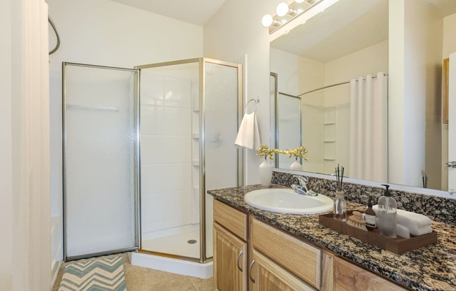 a bathroom with a sink and a shower at Stone Gate Apartments in NC