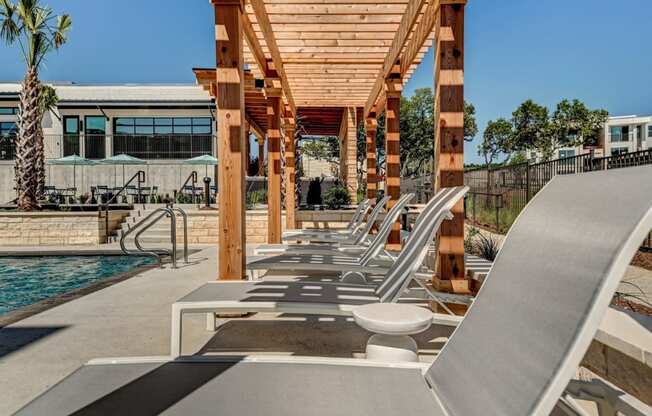 the pool and lounge chairs at the resort at longboat key club