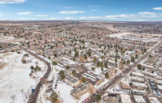 A small town with a lot of houses and cars.