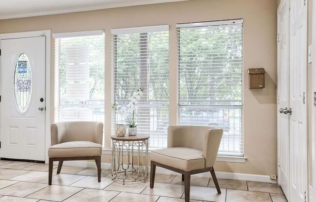 a room filled with furniture and a large window