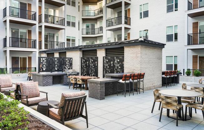 Outdoor lounge and grilling stations designed for gatherings at Modera LoSo.