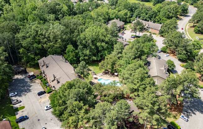 a aerial view of a neighborhood with houses and a swimming pool at The Summit Apartments, Tennessee, 38128