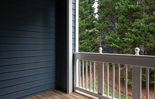 a balcony overlooking trees