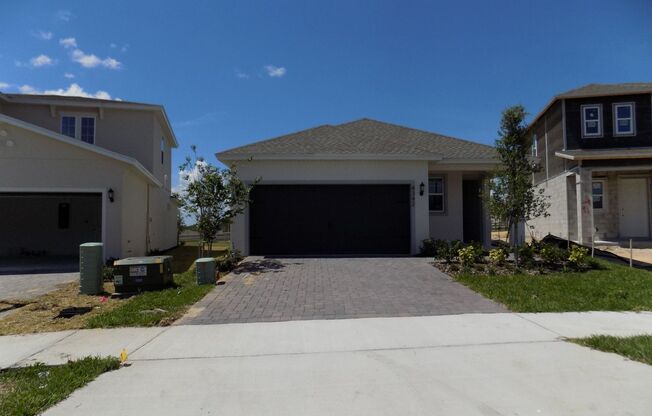 LOOKS LIKE NEW 4 BEDROOMS, 2 BATHS, 2 CAR GARAGE SINGLE FAMILY HOME IN CLERMONT