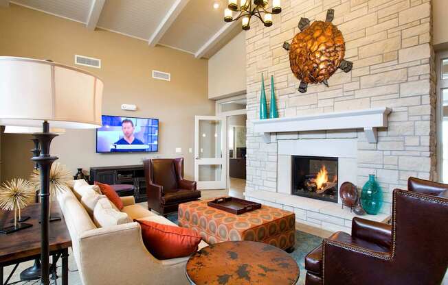 A living room with a fireplace and a television.