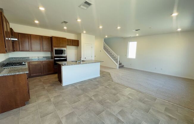 Brand new never lived in home in vibrant South West Las Vegas with open concept living room and kitchen with island and brand new appliances!