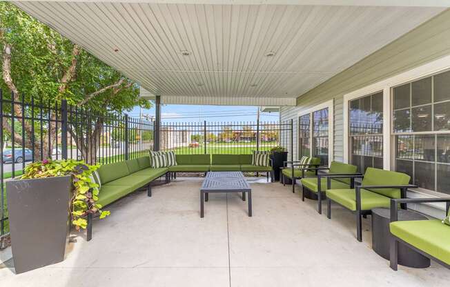 A patio with a table and chairs.