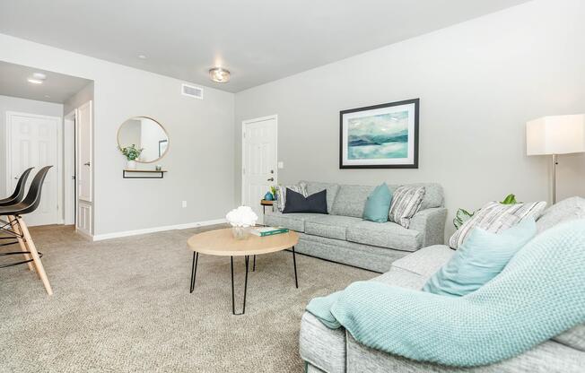 a bedroom with a bed and a chair in a room