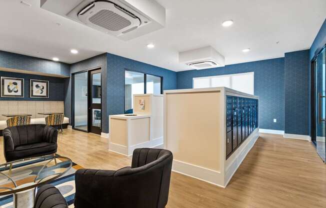 A living room with a black chair and a white cabinet.