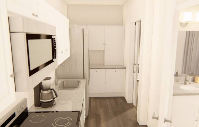 a kitchen with a stove top oven next to a microwave at Brownstones at Palisade Park Townhomes, Broomfield, 80023