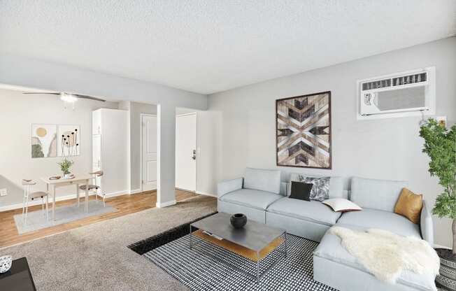 Model living room with view of dining