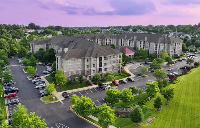 A large building with a parking lot in front of it.