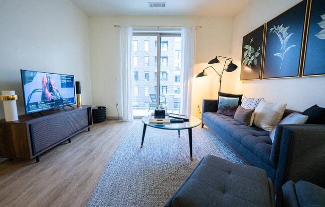 a living room with a couch and a tv
