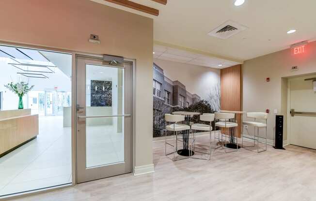 resident lounge with social seating and tables at archer park apartments in southeast Washington dc