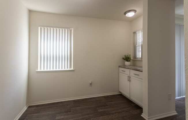 This is a photo of the dining room in the 970 square foot 2 bedroom, 2 bath apartment at Preston Park Apartments in Dallas, TX