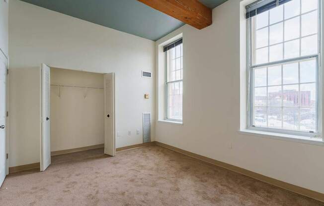 Empty room with a window and a door.