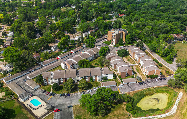 arial view of a neighborhood with houses and trees