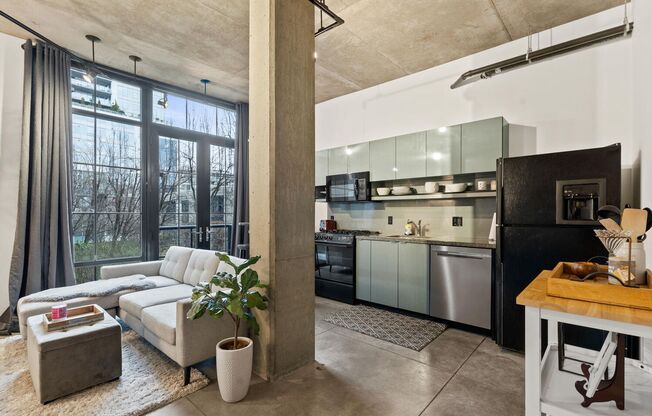 **FURNISHED** Streetcar Lofts studio w/parking/storage/Juliette balcony/fitness center/courtyard garden