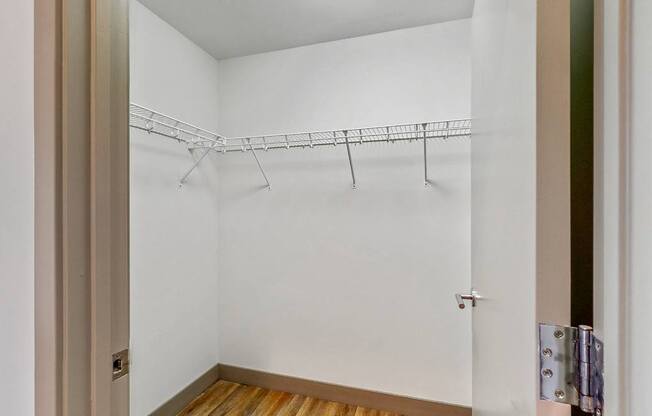 Easy living with plenty of storage space in the walk in closet of a 2 bedroom penthouse floor plan at Midtown Crossing Apartments Omaha