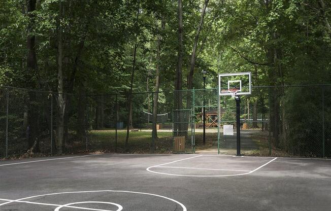 Fenced basketball court at Trillium Apartments, Fairfax, VA