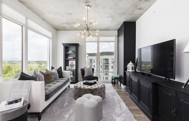 large living room with floor to ceiling windows at Lake Nona Pixon, Orlando, FL