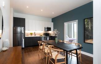 a kitchen and dining room with a table and chairs at The Irvine, Philadelphia, PA
