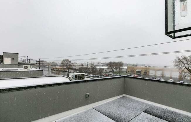 a balcony with a view of the city