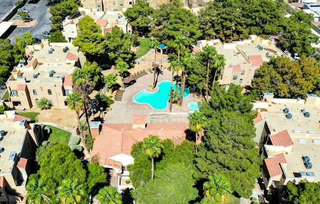 an aerial view of a house with a pool in the middle of a neighborhood at Pacific Harbors Sunrise Apartments, Las Vegas, NV, 89142