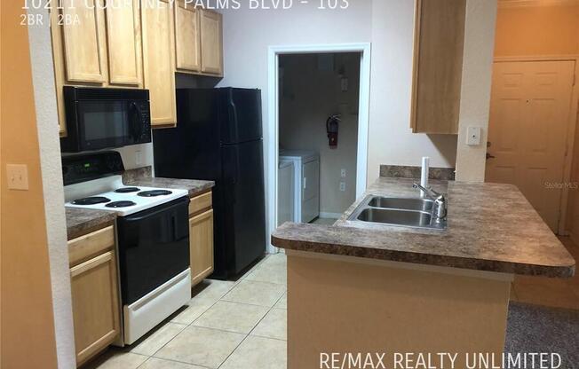 10211 COURTNEY PALMS BLVD