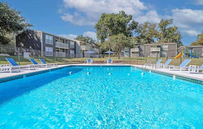 Large blue swimming pool at Maplewood apartments in Shreveport, LA.