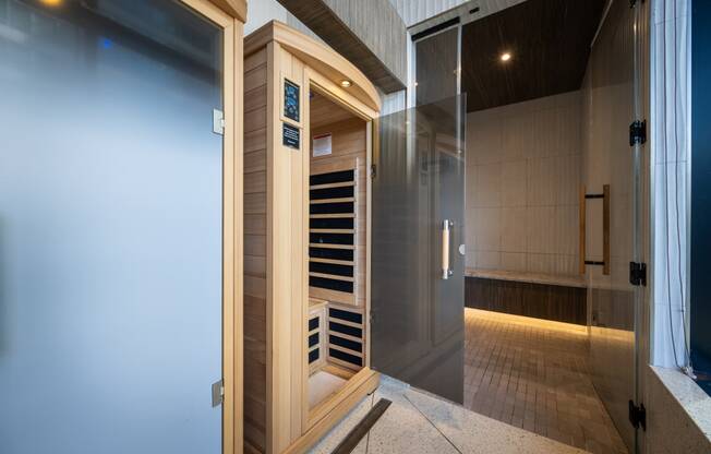 a sauna with a glass door