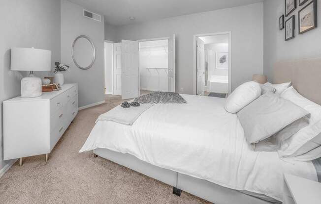 a white bedroom with a white bed and a white dresser, Henley Tampa Palms, Tampa, FL