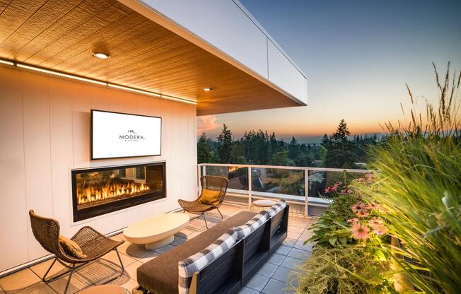 Take in the sunset from Modera Shoreline’s rooftop terrace, featuring a cozy fireplace, lush greenery, and breathtaking views of the Pacific Northwest.
