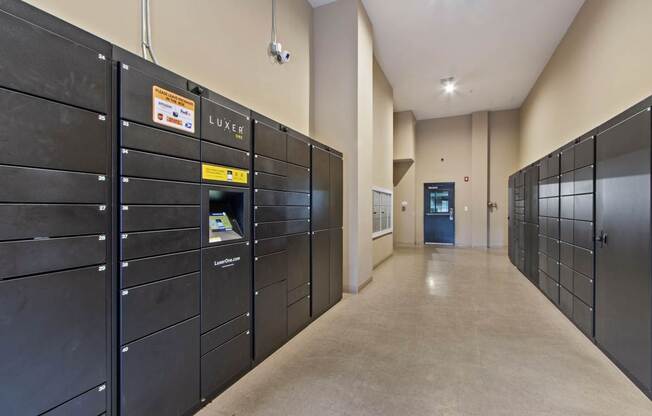 Apartments for Rent Near Camp Springs, MD - Tribeca at Camp Springs - A long hallway with black lockers on both