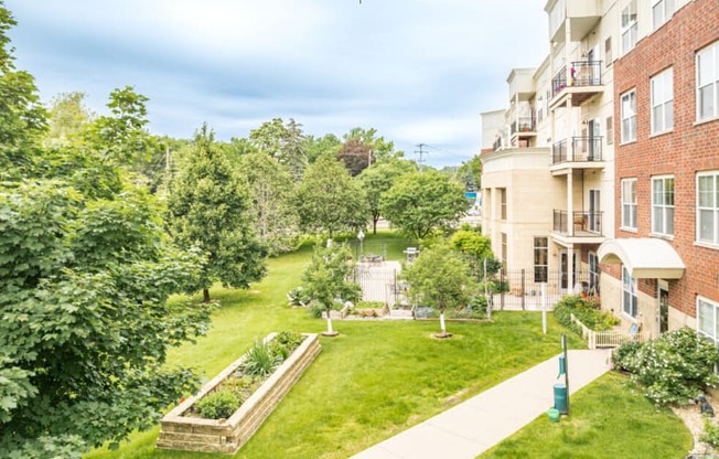 an aerial view of a park with trees and buildings