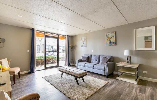 A living room with a grey sofa and a coffee table.