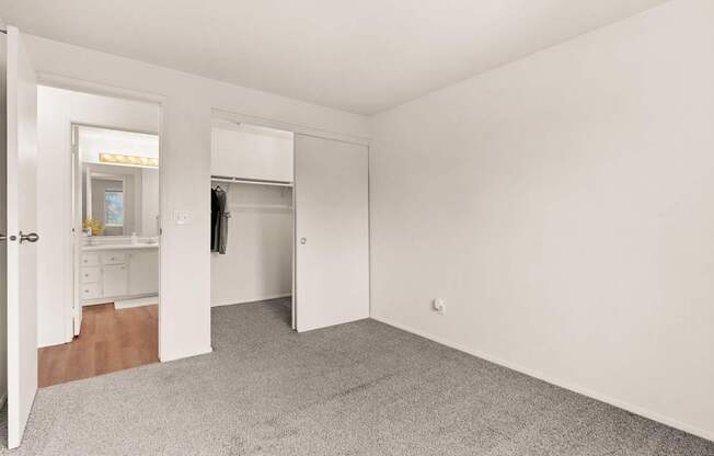 A room with a carpeted floor and white walls.